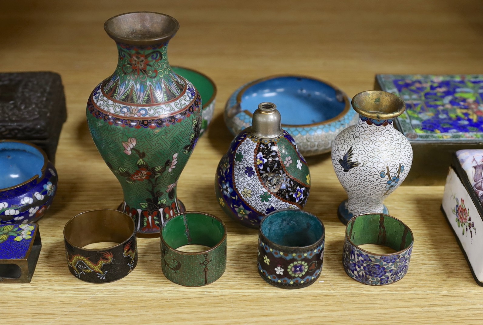 A group of Chinese and Japanese cloisonné enamel wares and a Continental enamel snuff box, largest 16cm